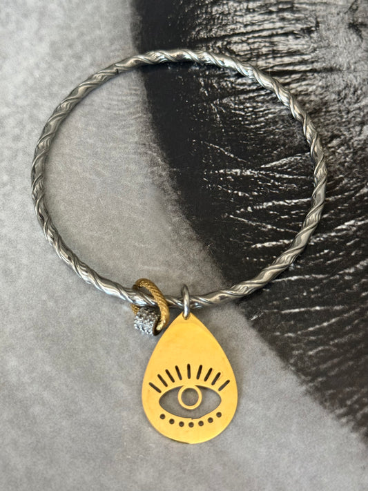 TWIST EYE SILVER BANGLE
